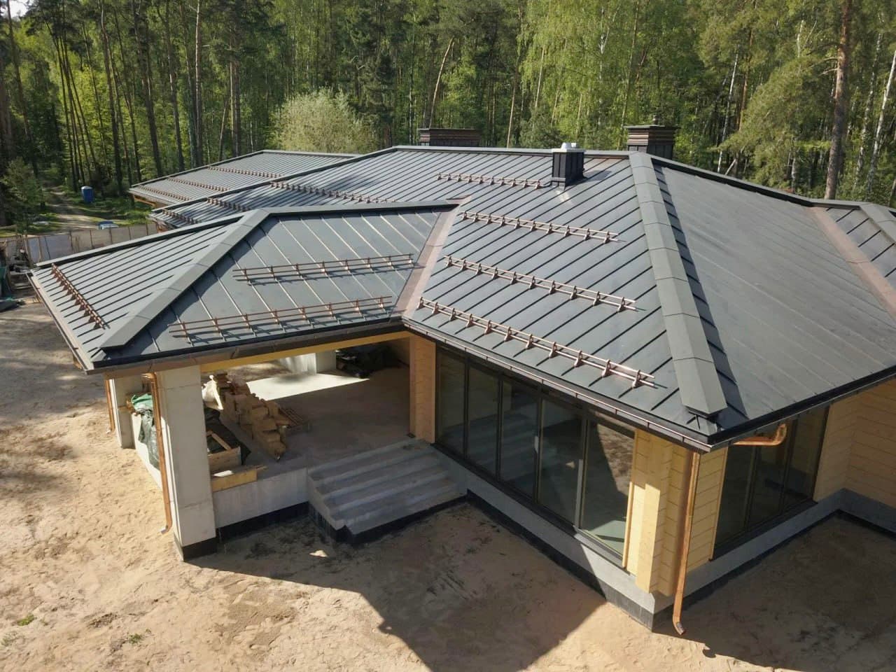 Standing seam metal roofing installation in Alberta